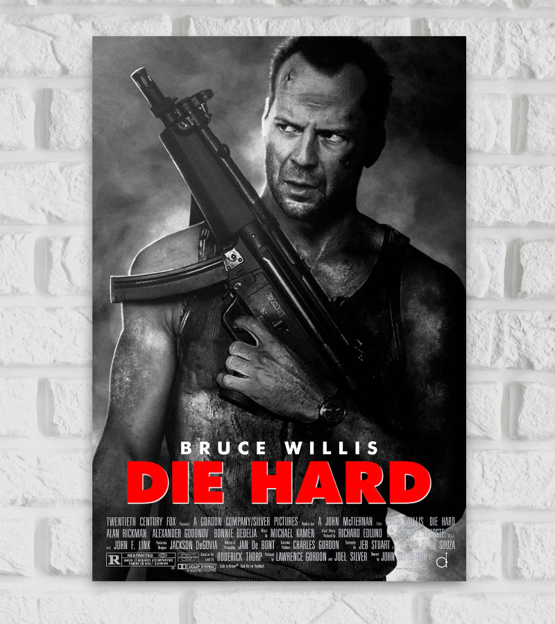 Poster for the action movie "Die Hard" featuring Bruce Willis. The image is in black and white, showing Bruce Willis as John McClane, bruised and intense, holding a large rifle over his shoulder. He wears a dirty tank top and has a focused, gritty expression. The movie title "DIE HARD" is displayed in bold red letters at the bottom, with "BRUCE WILLIS" written above it in white. Below the title are the film credits in small white text. The overall tone is dark and intense, reflecting the film's high-stakes