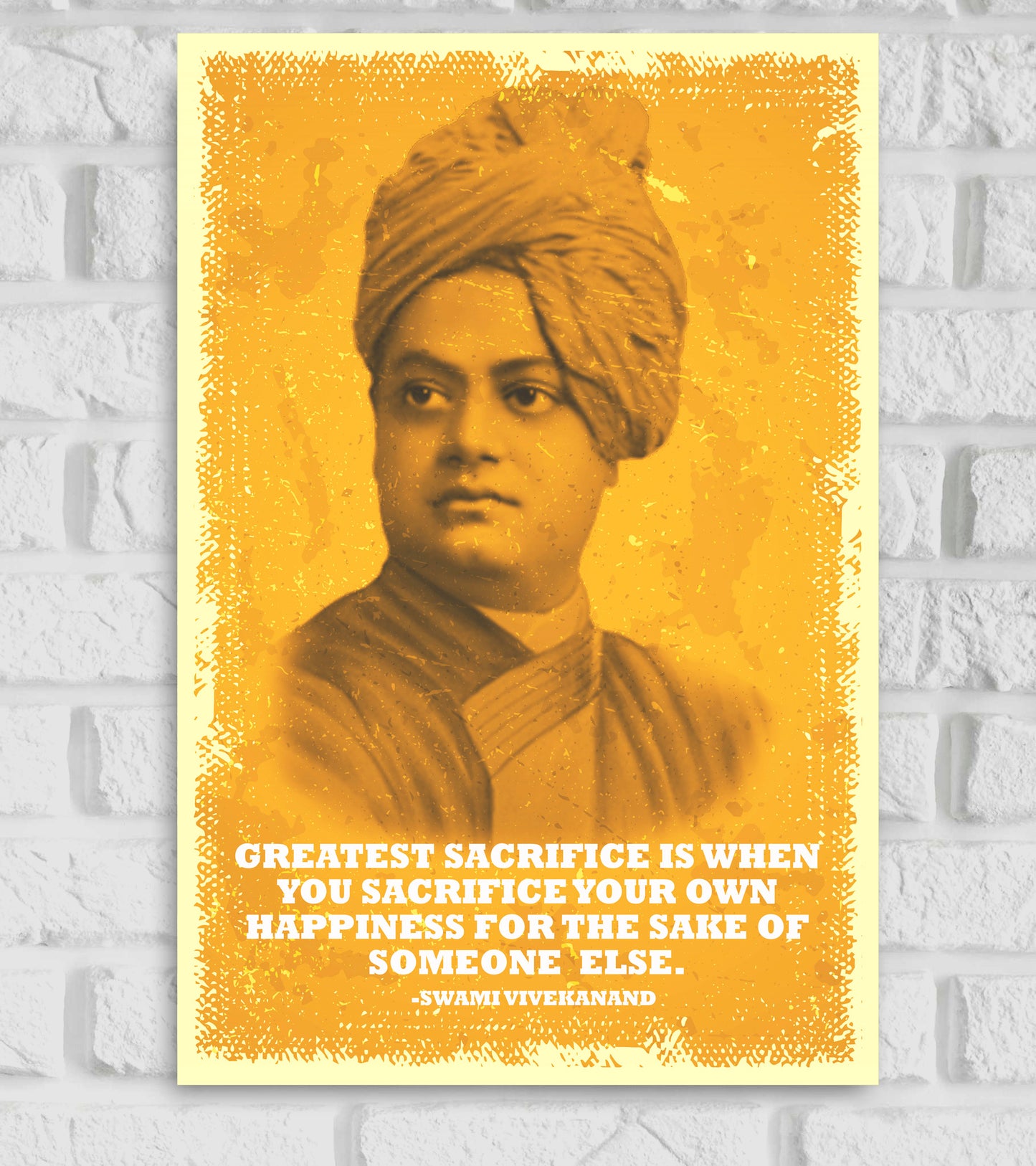 Poster of Swami Vivekananda in a vintage yellow tone with a textured border. The quote at the bottom reads: 'Greatest sacrifice is when you sacrifice your own happiness for the sake of someone else. – Swami Vivekanand.' The background is a distressed yellow with a white border