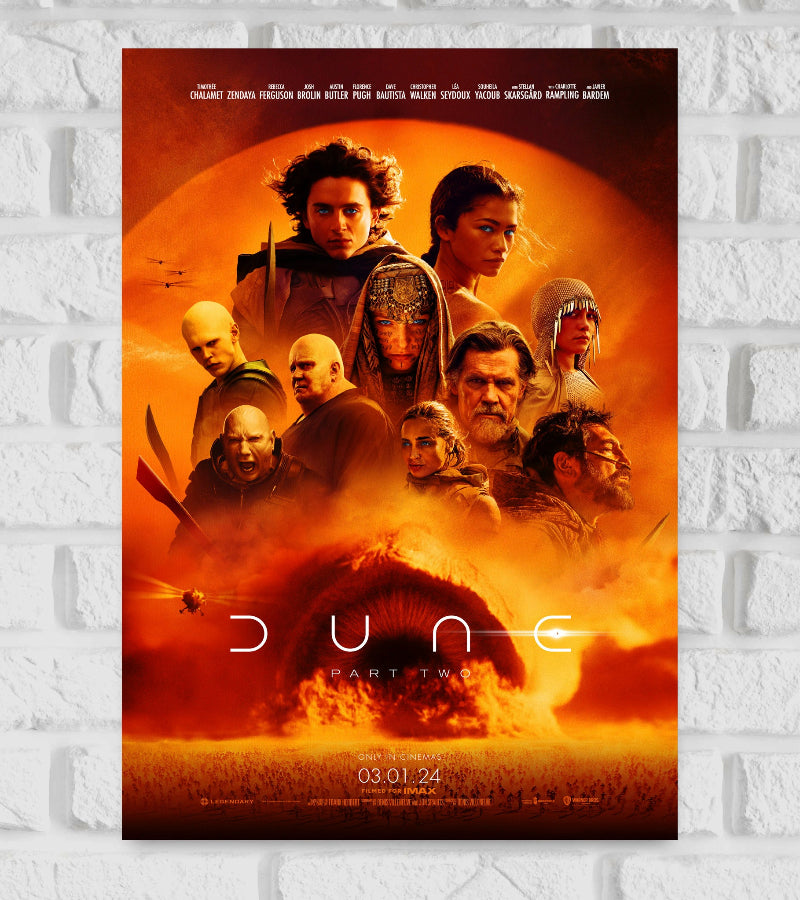 Poster of Dune: Part Two featuring the main characters, including Paul Atreides and Chani, gathered against a glowing orange desert background. A massive sandworm emerges from the sand at the bottom, with helicopters flying nearby. The title "Dune Part Two" is displayed across the center, and the release date "03.01.24" is noted at the bottom, with the tagline "Only in cinemas. Filmed for IMAX." appearing below Paul Atreides Sci-fi Adventure Hollywood Action Actor Actress