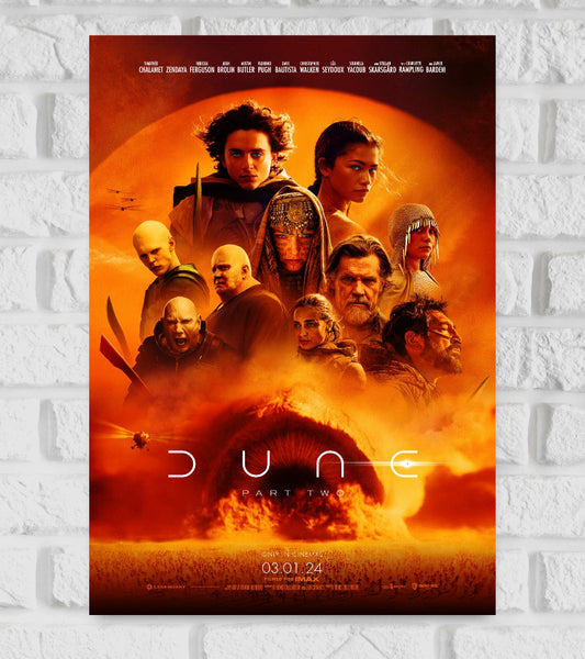 Poster of Dune: Part Two featuring the main characters, including Paul Atreides and Chani, gathered against a glowing orange desert background. A massive sandworm emerges from the sand at the bottom, with helicopters flying nearby. The title "Dune Part Two" is displayed across the center, and the release date "03.01.24" is noted at the bottom, with the tagline "Only in cinemas. Filmed for IMAX." appearing below Paul Atreides Sci-fi Adventure Hollywood Action Actor Actress