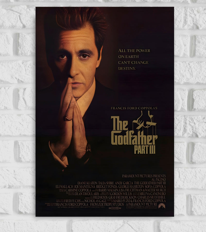 Poster of the movie The Godfather Part III featuring Al Pacino in a solemn pose with his hands clasped near his face. The background is dark, with the quote "All the power on Earth can't change destiny" written on the right. The title “The Godfather Part III” is displayed in gold lettering below, along with credits for the cast and crew. The poster has a dramatic and serious tone, fitting the film's theme Hollywood American crime films Francis Ford Coppola Mario Puzo epic gangster