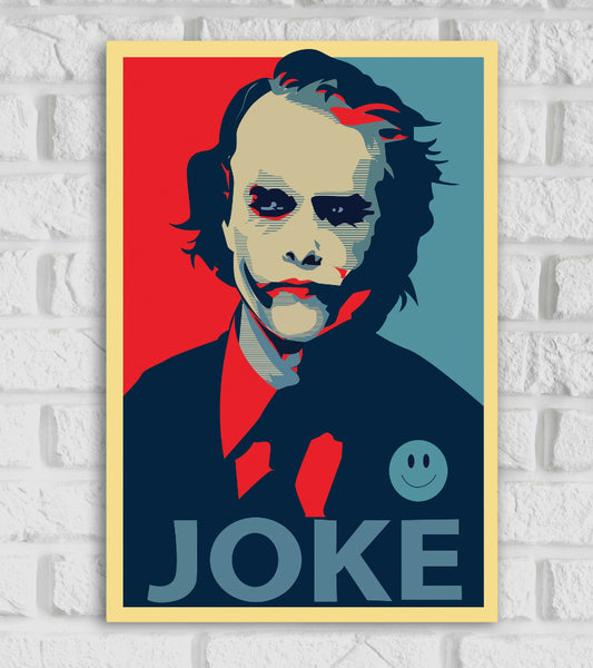 Poster of the Joker designed in a pop-art, propaganda-style with bold, contrasting colors—mainly red, blue, and beige. The Joker, portrayed with his signature makeup and unsettling grin, is centered in the image wearing a suit and tie. A smiley face button is visible on his chest. The word "JOKE" is written in large capital letters at the bottom, mimicking the iconic "HOPE" poster style Hollywood Movie The Dark Knight Crime Thrill Action 