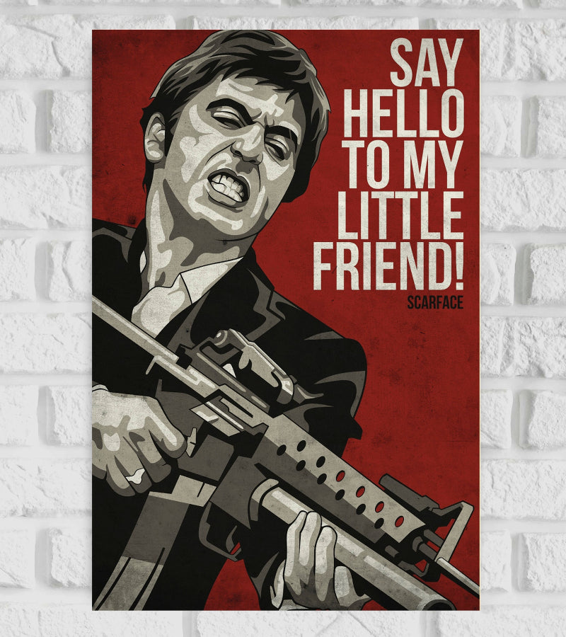 Stylized poster of Scarface featuring a bold, graphic illustration of Tony Montana holding a machine gun and yelling. The background is deep red, and large white text on the right reads, “SAY HELLO TO MY LITTLE FRIEND!” with “SCARFACE” written below in smaller font. The poster captures the intense and iconic moment from the film Crime Action Drama Hollywood Movies Angel and Chi-Chi 