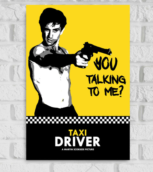 Poster of the movie Taxi Driver featuring a stylized, black-and-white illustration of a shirtless man pointing a gun, with a bold yellow background. The iconic quote 'You talking to me?' is written in black graffiti-style text. Below, a black section with a checkered strip includes the movie title 'TAXI DRIVER' and the tagline 'A Martin Scorsese Picture'."