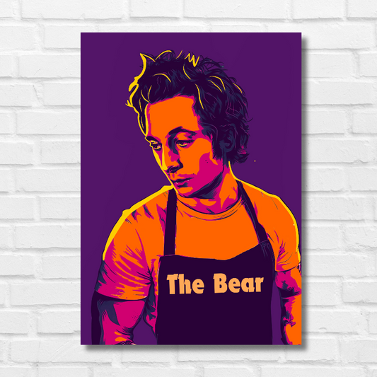 Poster of The Bear featuring a vibrant pop-art style illustration of a young man wearing a dark apron with the show's title "The Bear" printed on it. The character is depicted in bold shades of orange, pink, and purple against a deep purple background, with a contemplative expression and tousled hair, reflecting the intense and emotional tone of the series Hollywood English merican psychological comedy-drama television series