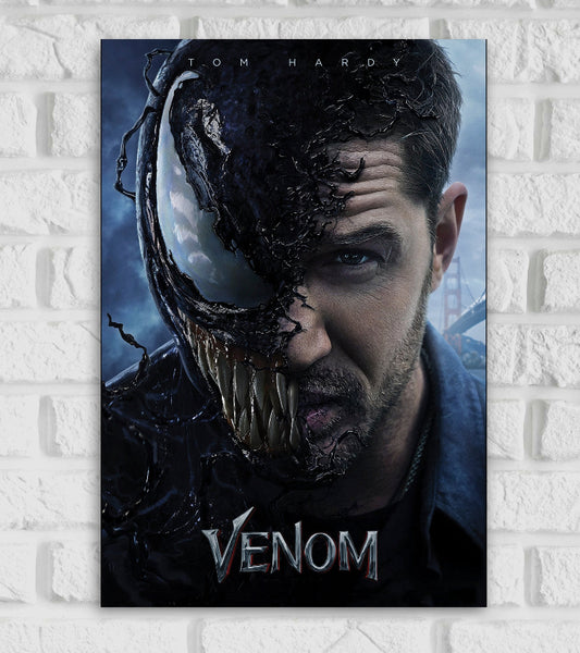 Poster for the Marvel film "Venom" featuring Tom Hardy The image shows a dramatic split face—half is Eddie Brock (played by Tom Hardy), and the other half is transformed into the menacing sharp-toothed symbiote Venom The black alien substance is shown creeping across his face with a monstrous eye jagged teeth visible The background includes a faint view of the Golden Gate Bridge suggesting the film's setting At the bottom the title "VENOM" is written in a metallic edgy font Hollywood American superhero