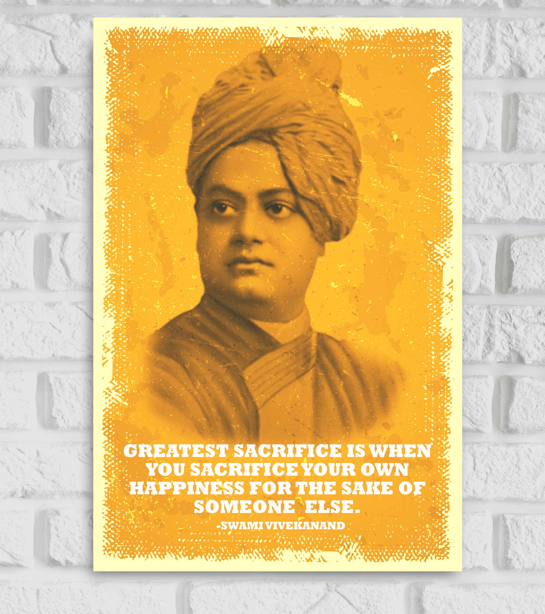 Poster of Swami Vivekananda in a vintage yellow tone with a textured border. The quote at the bottom reads: 'Greatest sacrifice is when you sacrifice your own happiness for the sake of someone else. – Swami Vivekanand.' The background is a distressed yellow with a white border